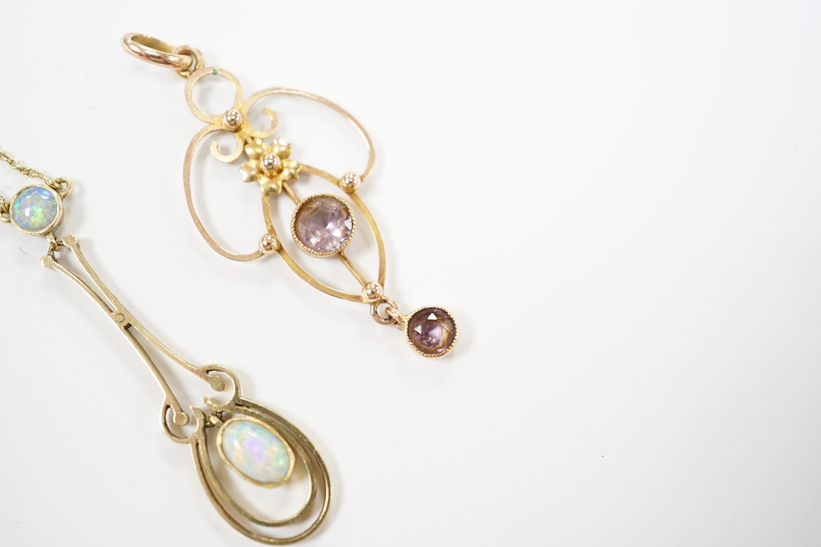 An Edwardian 15ct and two stone white opal set drop pendant necklace, chain unmarked, overall 46cm, and one other Edwardian 9ct and gem set pendant, 40mm.